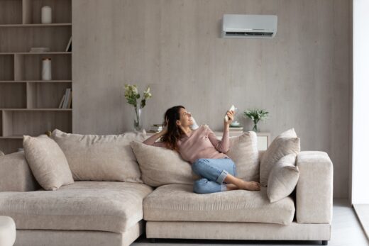 Relaxed,young,hispanic,female,homeowner,sitting,on,huge,comfortable,couch,