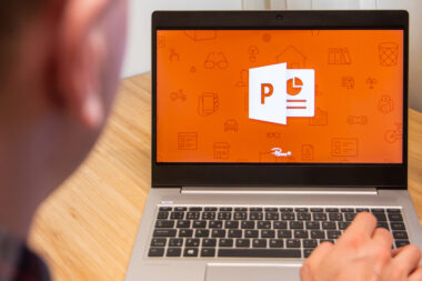 Powerpoint,is,used,by,a,man,on,the,laptop.,microsoft