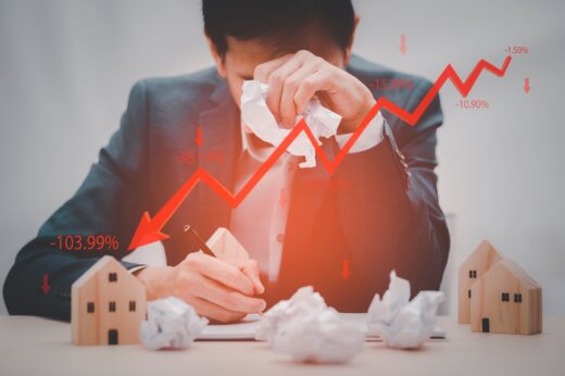 Concept,of,falling,real,estate,market,,down,arrow,and,wooden