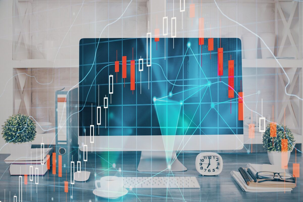 Forex,graph,hologram,on,table,with,computer,background.,double,exposure.
