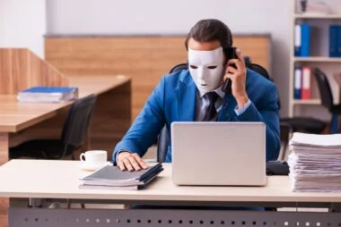 Young,male,employee,wearing,masks,in,the,office