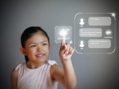 Little,girl,hand,using,a,digital,chatbot,program,for,online