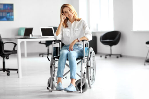 Young,woman,in,wheelchair,at,workplace