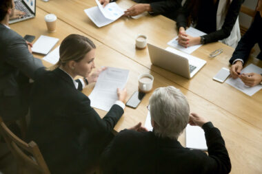 Negotiations,concept,,different,businesspeople,discussing,deal,details,at,group,meeting,