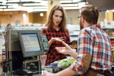 Photo,of,confused,young,lady,standing,in,supermarket,shop,near