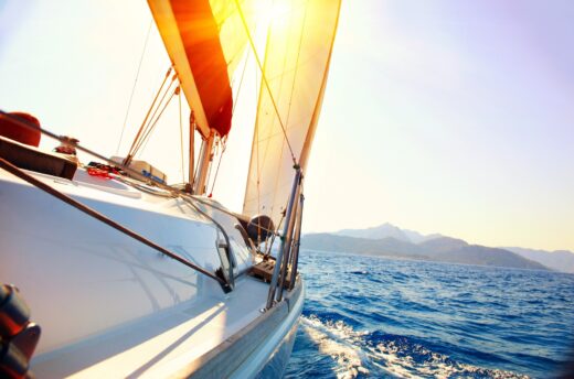 Yacht,sailing,against,sunset.,sailboat.,yachting.,sailing.,travel,concept.,vacation