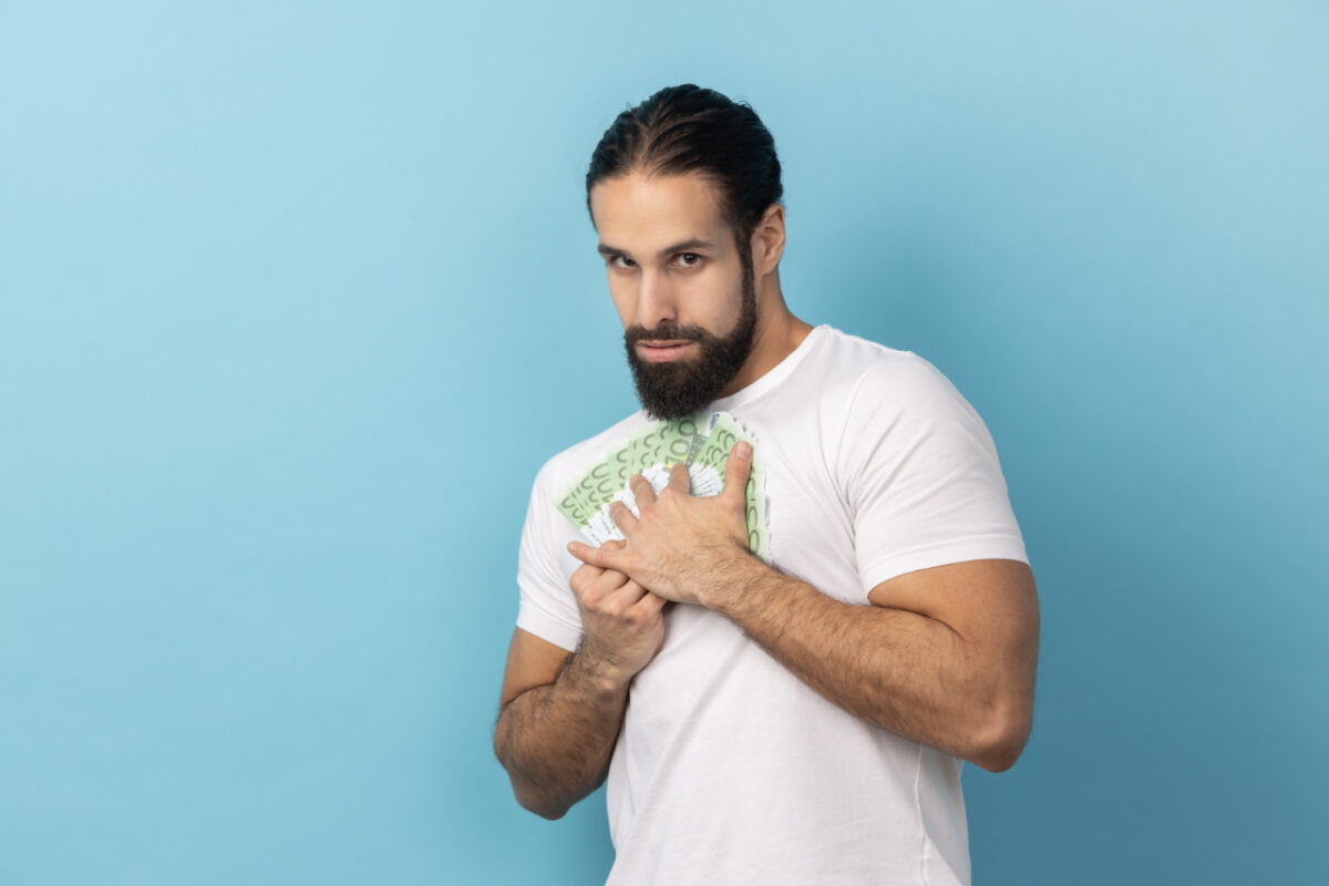 Portrait,of,man,wearing,white,t Shirt,embracing,euro,banknotes,looking