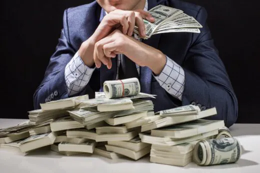 Man,holding,money,in,hand,at,black,background,,man,receive