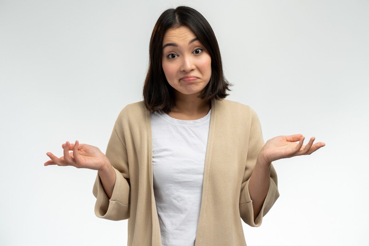 Have,no,idea,,maybe.,portrait,of,confused,girl,shrugging,shoulders