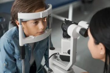 Female,doctor,ophthalmologist,doing,basic,eye,examination,of,cute,boy