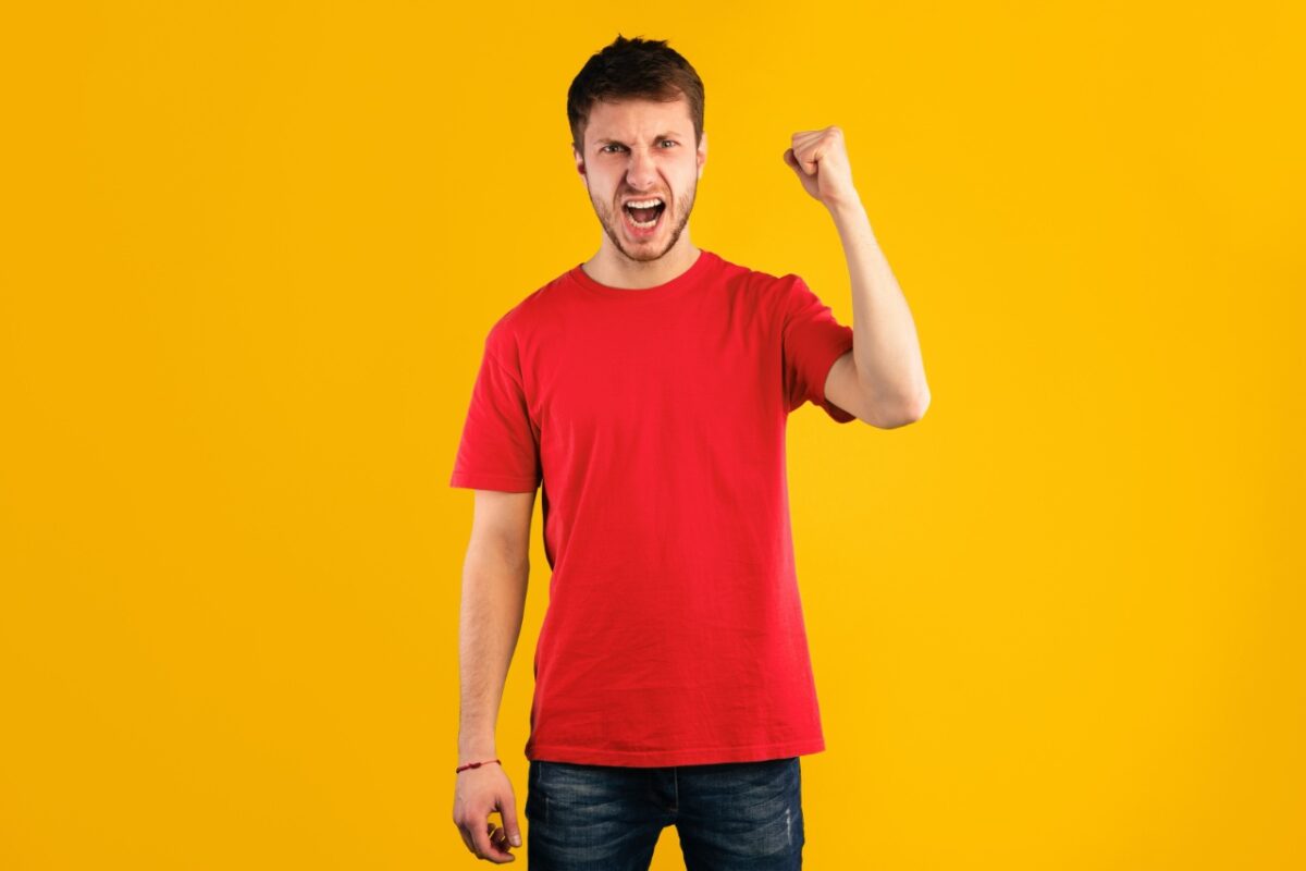 Hate,,rage,and,anger.,portrait,of,young,mad,guy,shaking