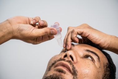 An,asian,man,gently,cares,for,his,eyes,using,sterile