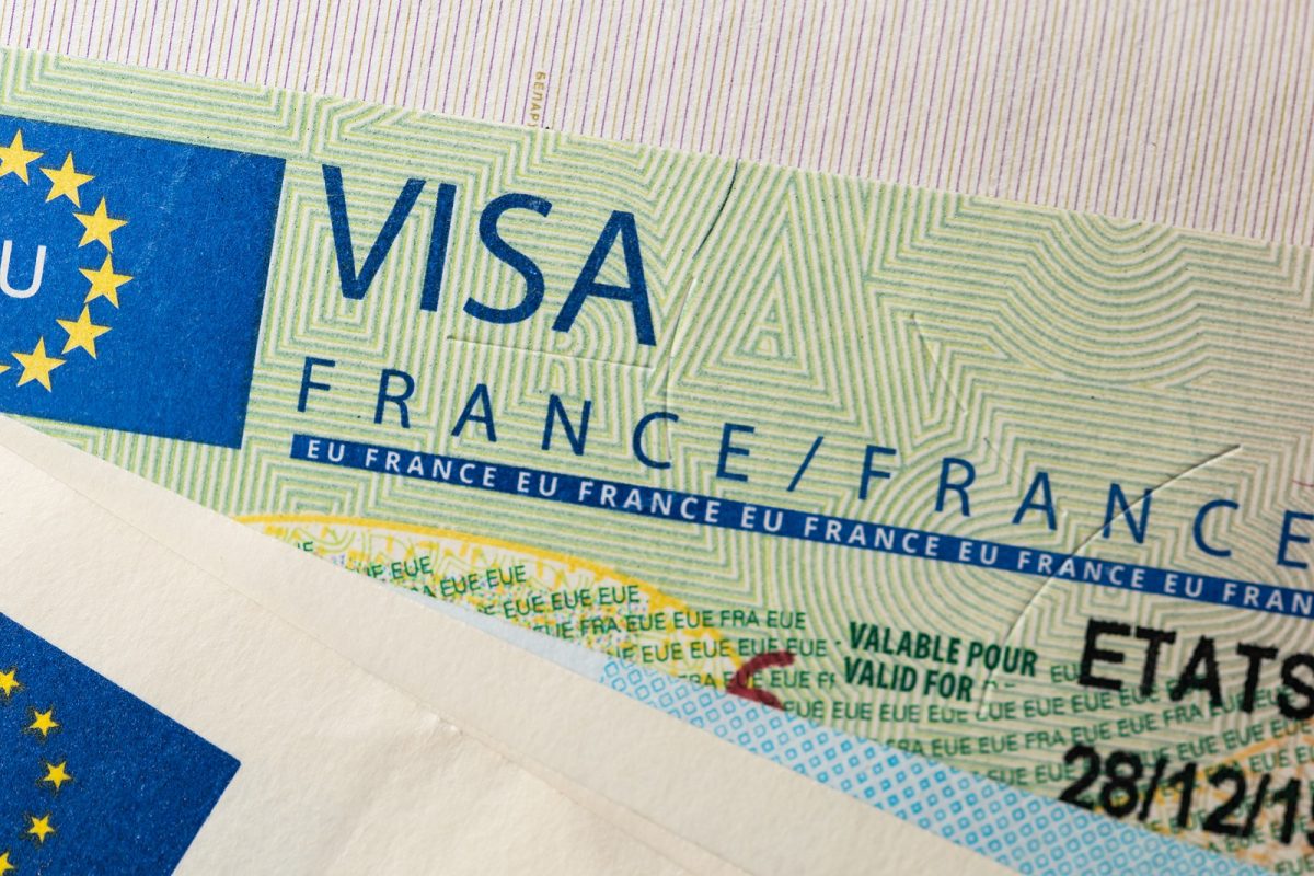Schengen,visa,in,the,passport.,issued,by,the,french,embassy.