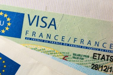 Schengen,visa,in,the,passport.,issued,by,the,french,embassy.