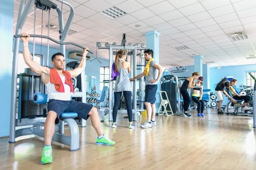 Small,group,of,sportive,friends,at,gym,fitness,club,center