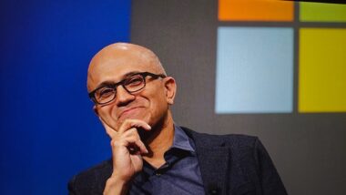 Satya,nadella,,ceo,of,microsoft,,at,a,conference,with,a