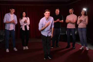 Professional,actors,bowing,on,stage,in,theatre