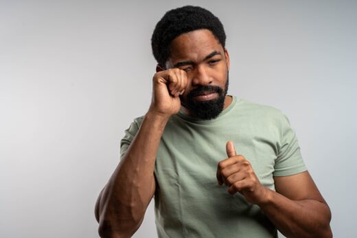 Black,man,rubbing,eyes,with,discomfort,,irritated,and,tired,,experiencing