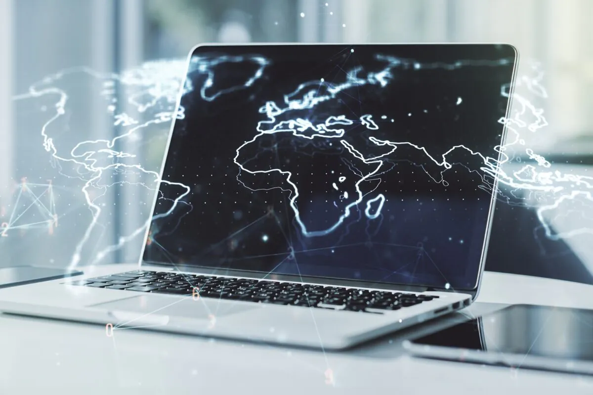 Double,exposure,of,abstract,digital,world,map,on,laptop,background,
