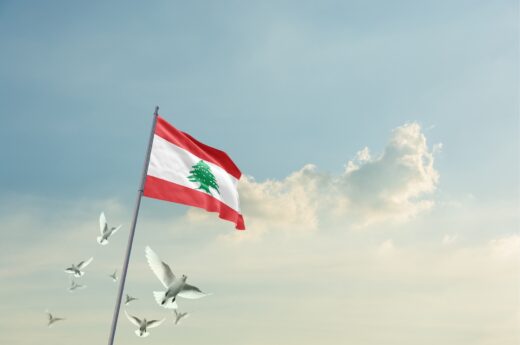 Lebanon,flag,waving,with,flying,doves,in,beautiful,sky.,lebanon