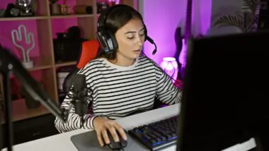 Hispanic,woman,streams,videogames,in,a,neon Lit,home,office,,showcasing